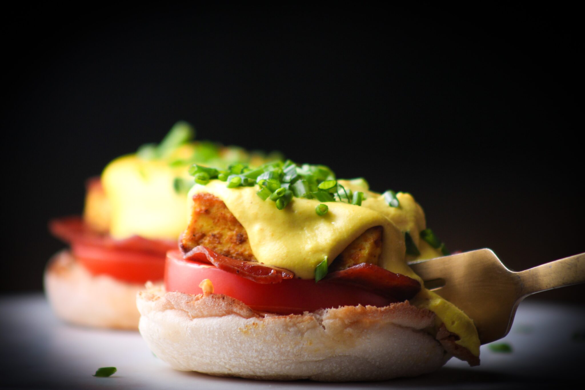 tofu Benedict with chives on top and cashew hollandaise sauce.