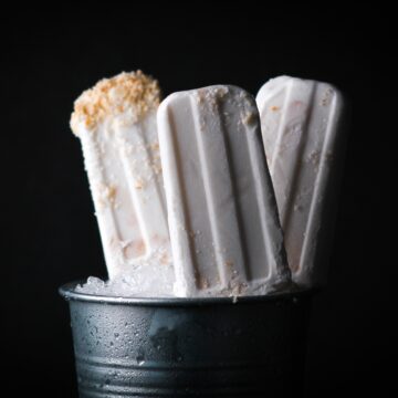 Popsicles in a bucket of ice.