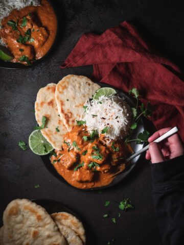 Bowl of Vegan Chicken Tikka Masala with Basmati Rice and Naan.