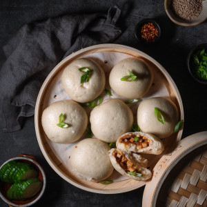 tofu steamed buns in a steamer basket.