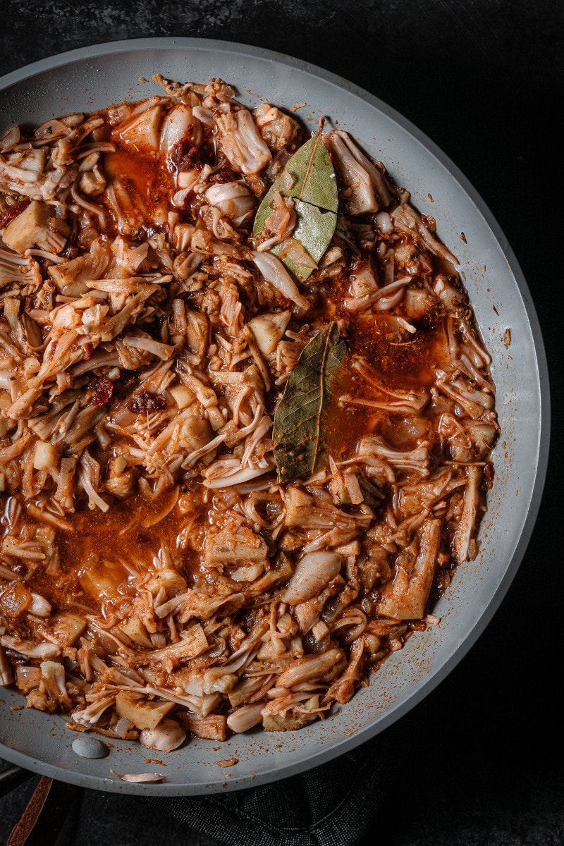 All the jackfruit barbacoa ingredients combined in a frying pan before cooking.