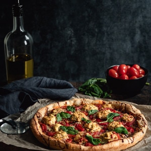 Pizza with ricotta and fresh basil.