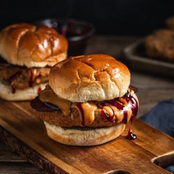 photo of two fried chicken sandwiches with grape jelly glaze and peanut butter sauce