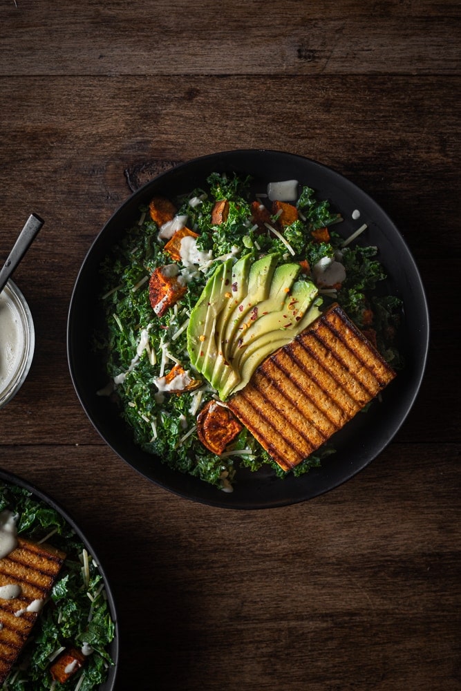Kale salad with avocado and grilled tofu.