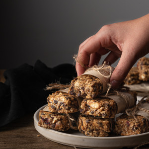 granola bars stacked on a plate.