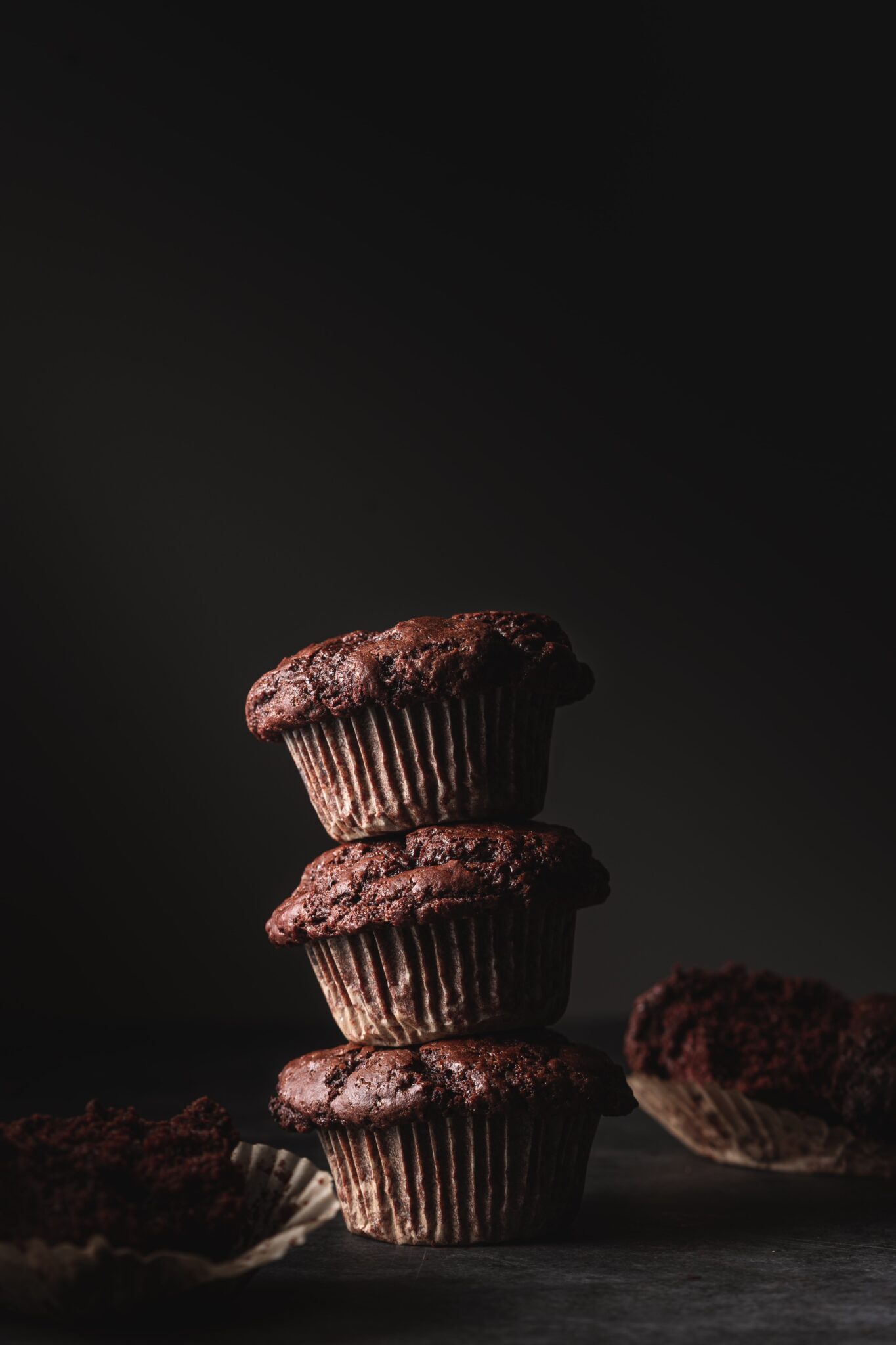 Stack of double chocolate olive oil muffins.