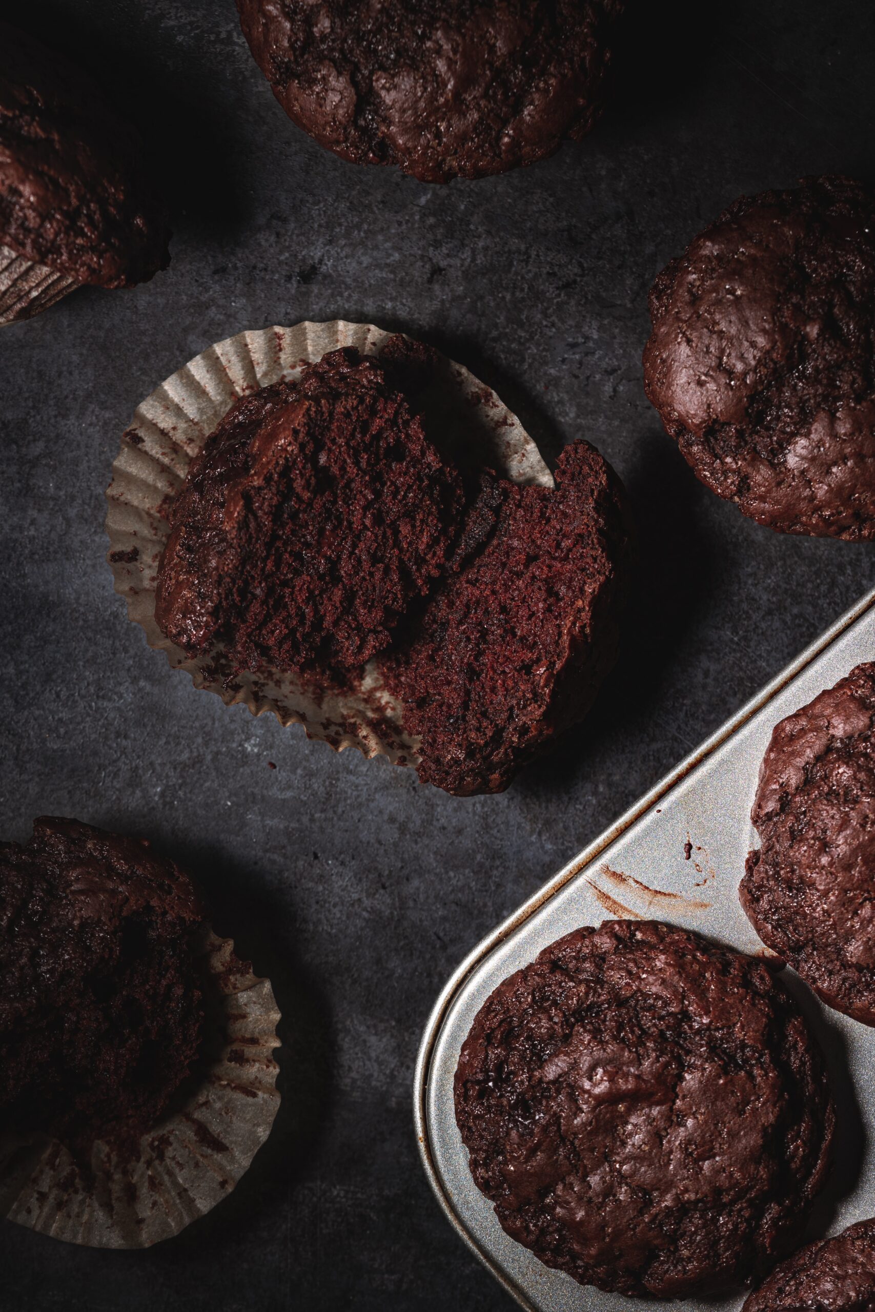 double chocolate olive oil muffins in muffin tin.