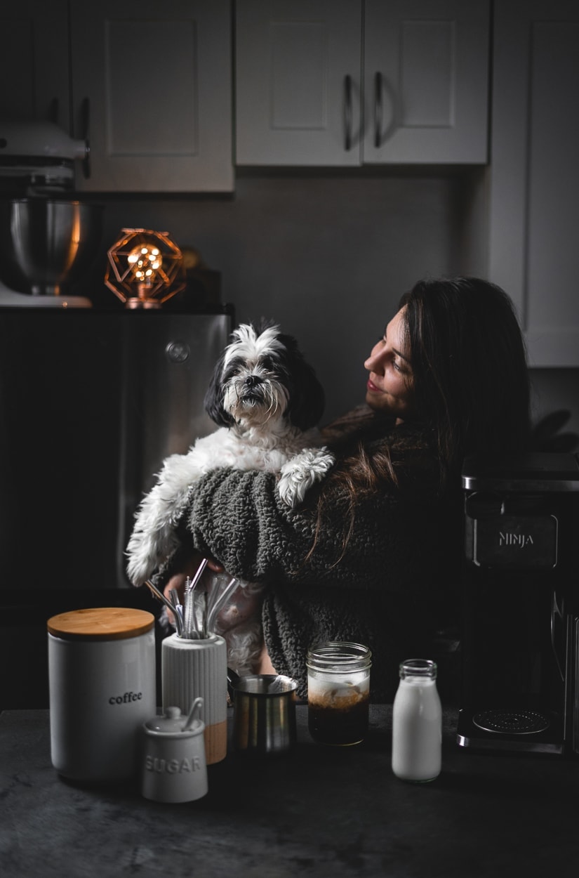 Liv and a dog with a coffee set up.
