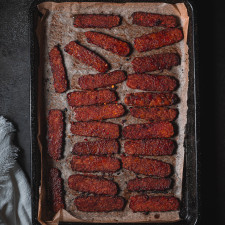Tempeh bacon on a baking tray.