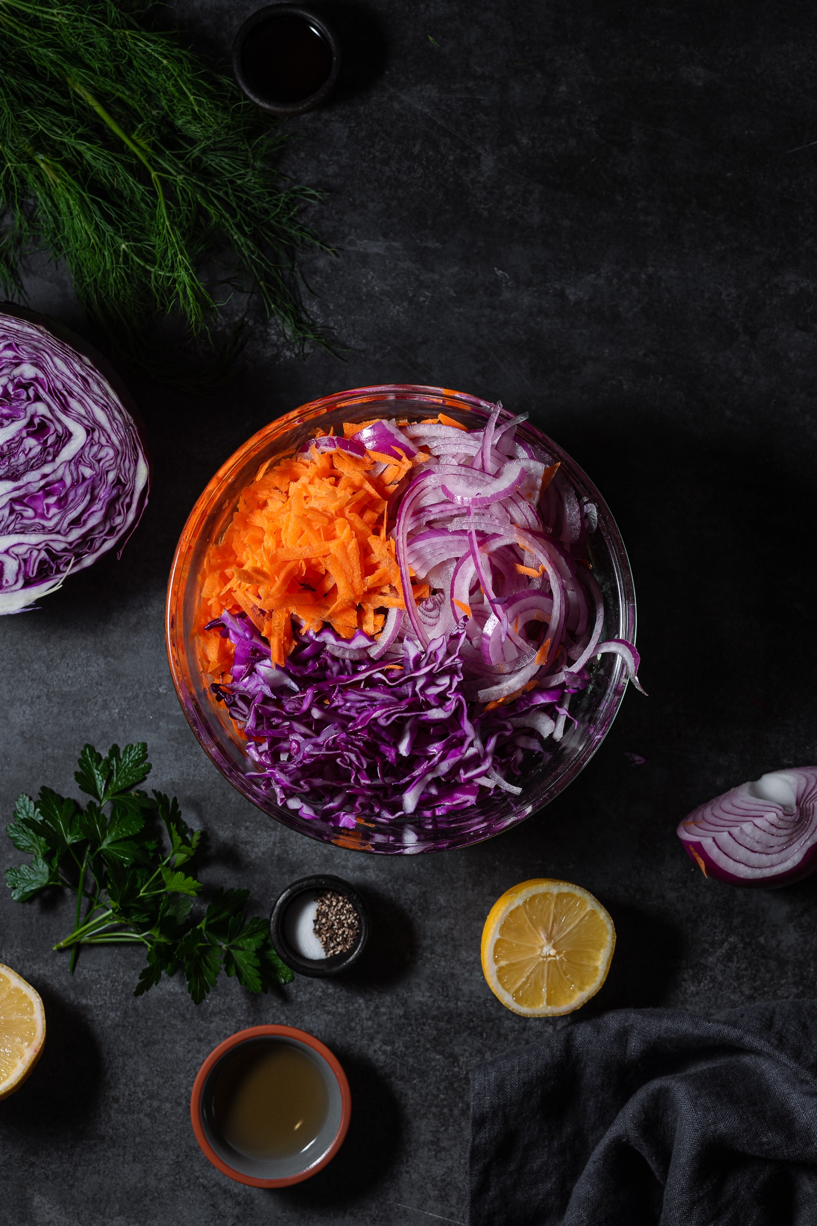 thinly sliced red cabbage, carrots and onion in a large bowl.
