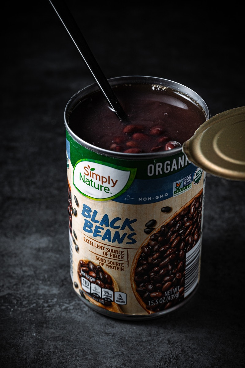 Can of black beans with the lid open.