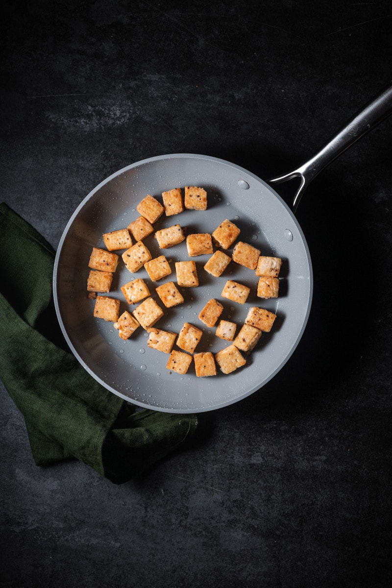 Crispy tofu in a pan.