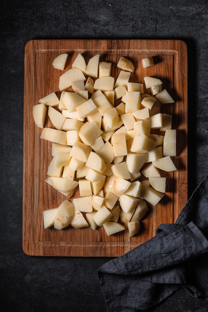 Diced potatoes on a cutting board.