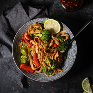 Vegetable stir fry in a bowl with stir fry sauce.