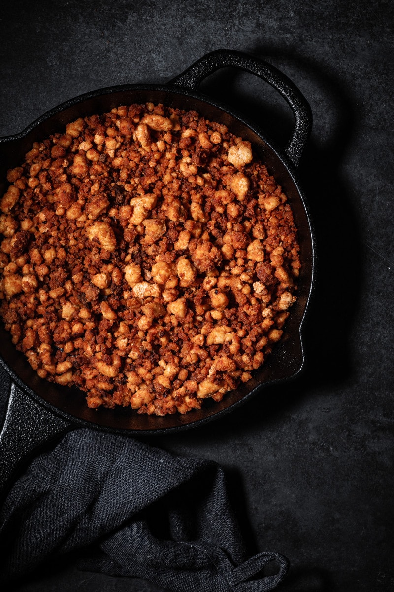 Crumbled tofu ground beef in a skillet.