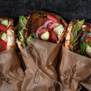 3 gyros wrapped in parchment.
