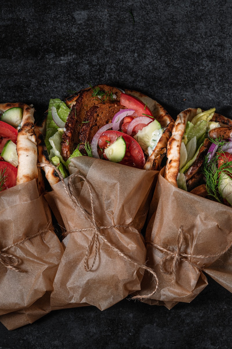 3 gyros wrapped in parchment.