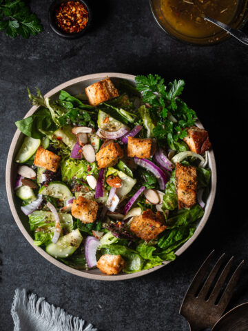 Green salad with Italian dressing and croutons.