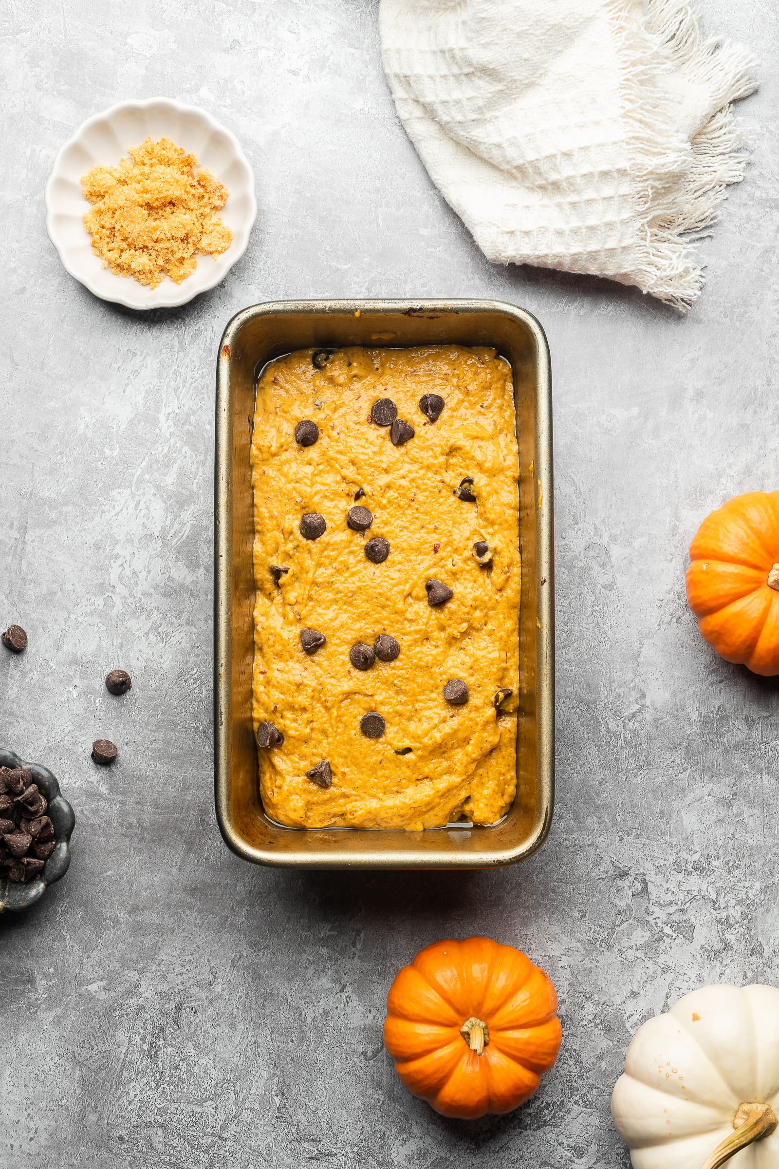 Pumpkin chocolate chip bread batter in a loaf pan.