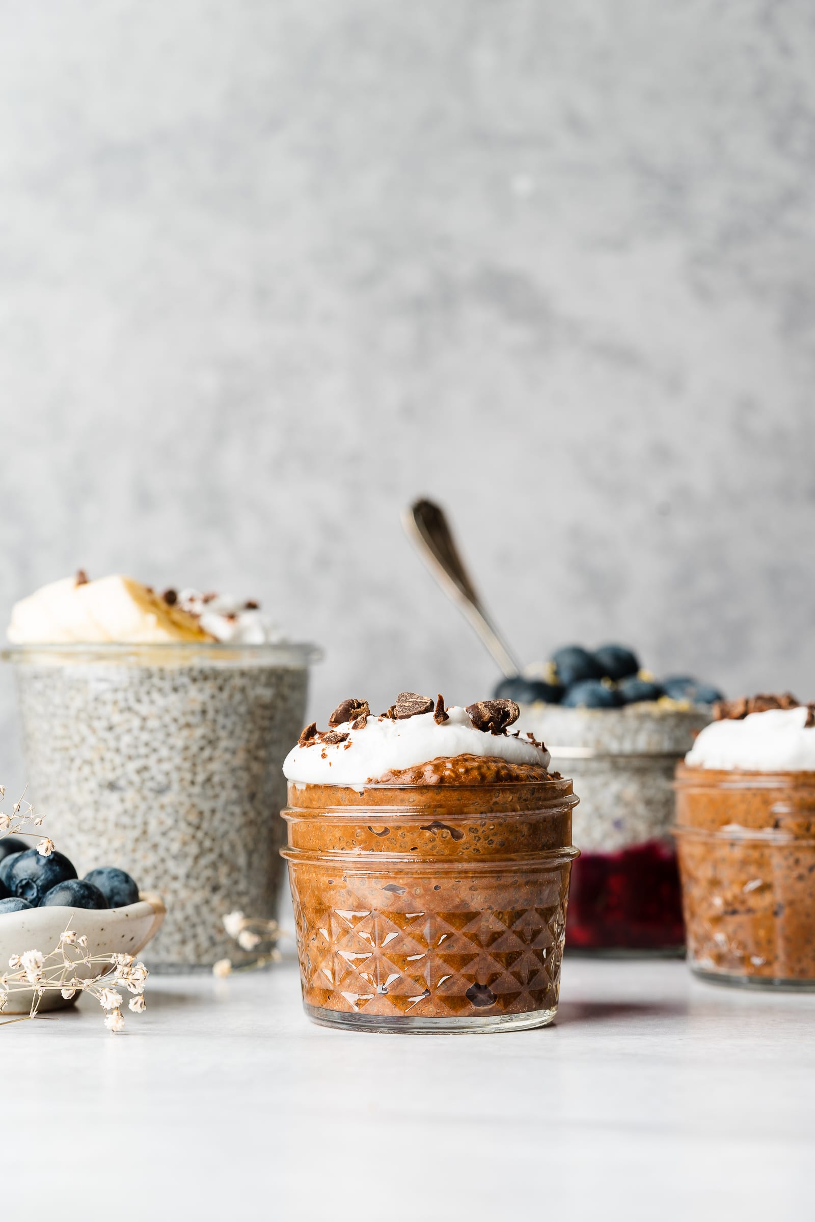 Variations of chia pudding in a row.