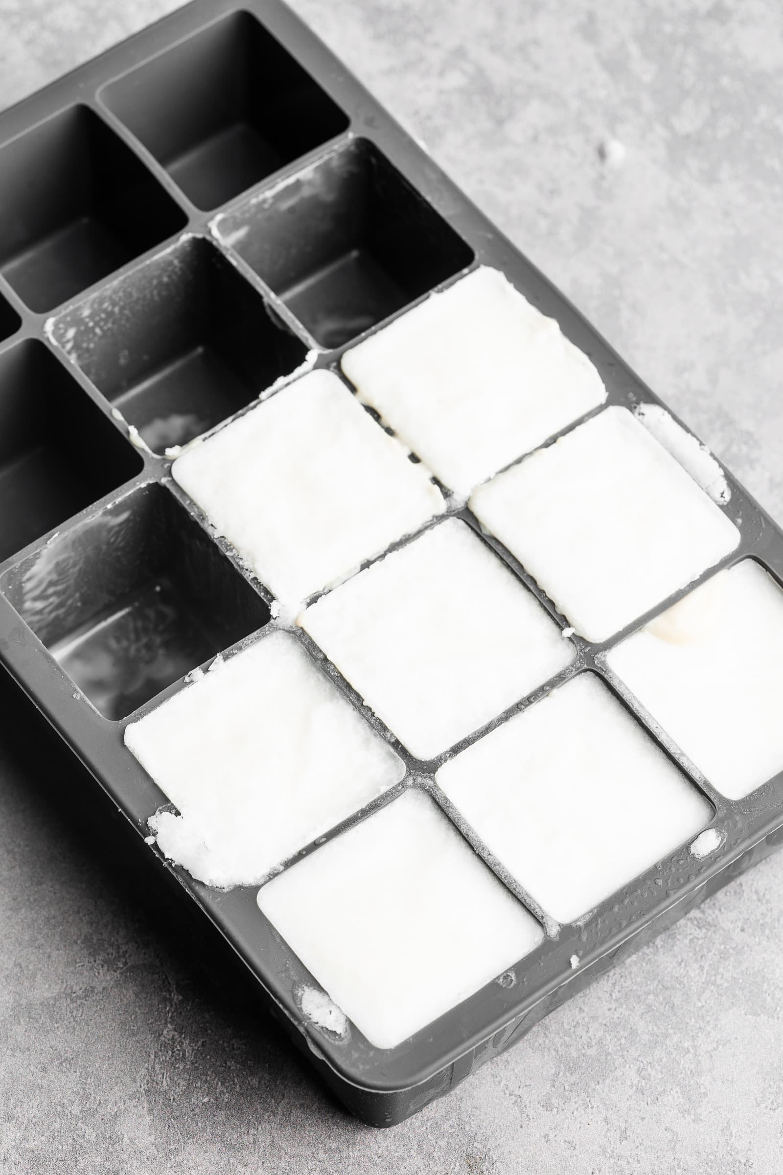 Frozen coconut milk in an ice cube trays.