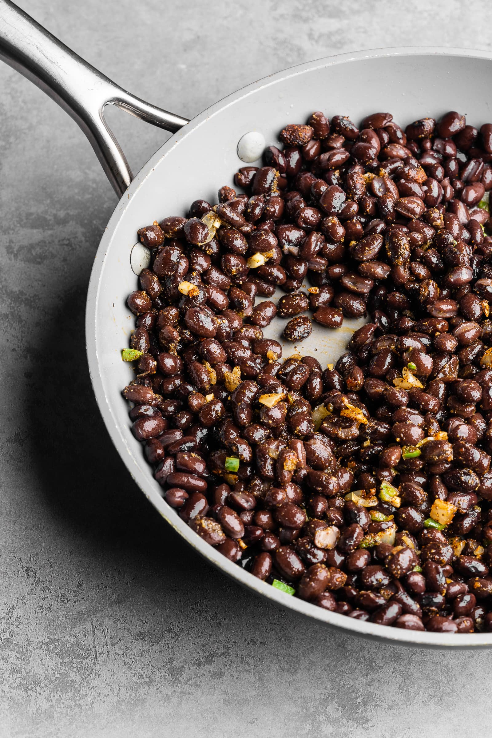 Black beans in a frying pan.