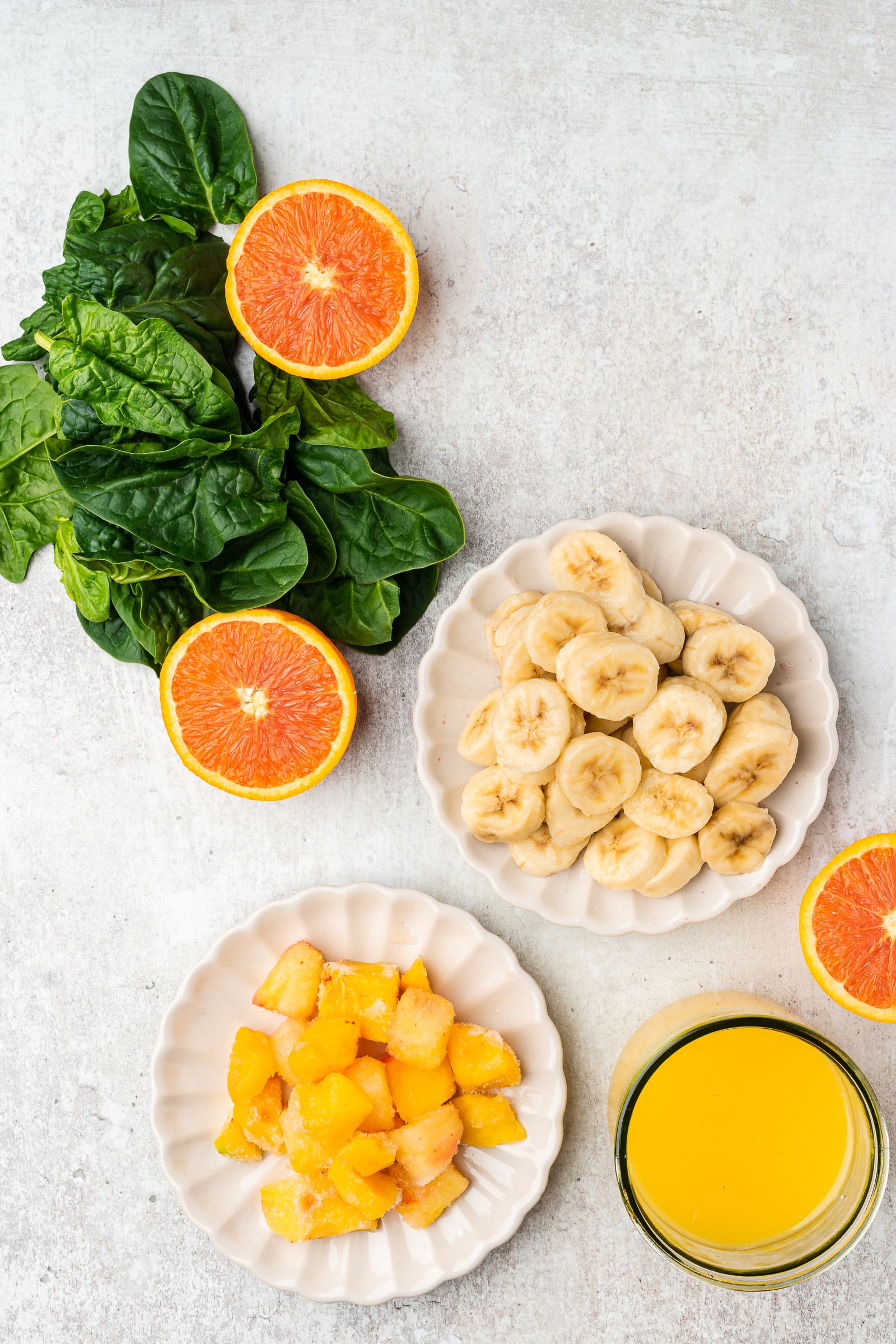 Orange spinach smoothie ingredients.