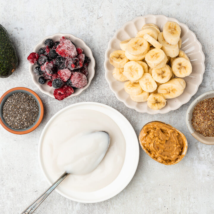 Yogurt substitutes for smoothies including sliced bananas, vegan yogurt, frozen berries, chia seeds, and peanut butter.