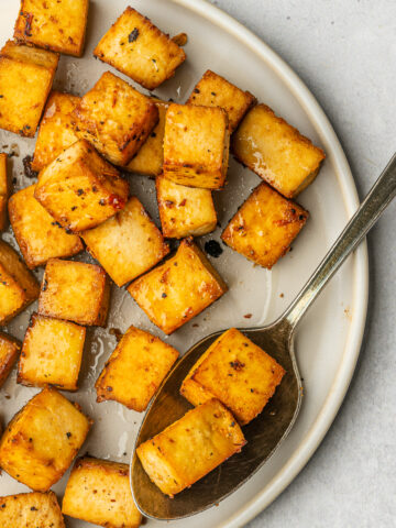 Baked tofu on a serving plate.
