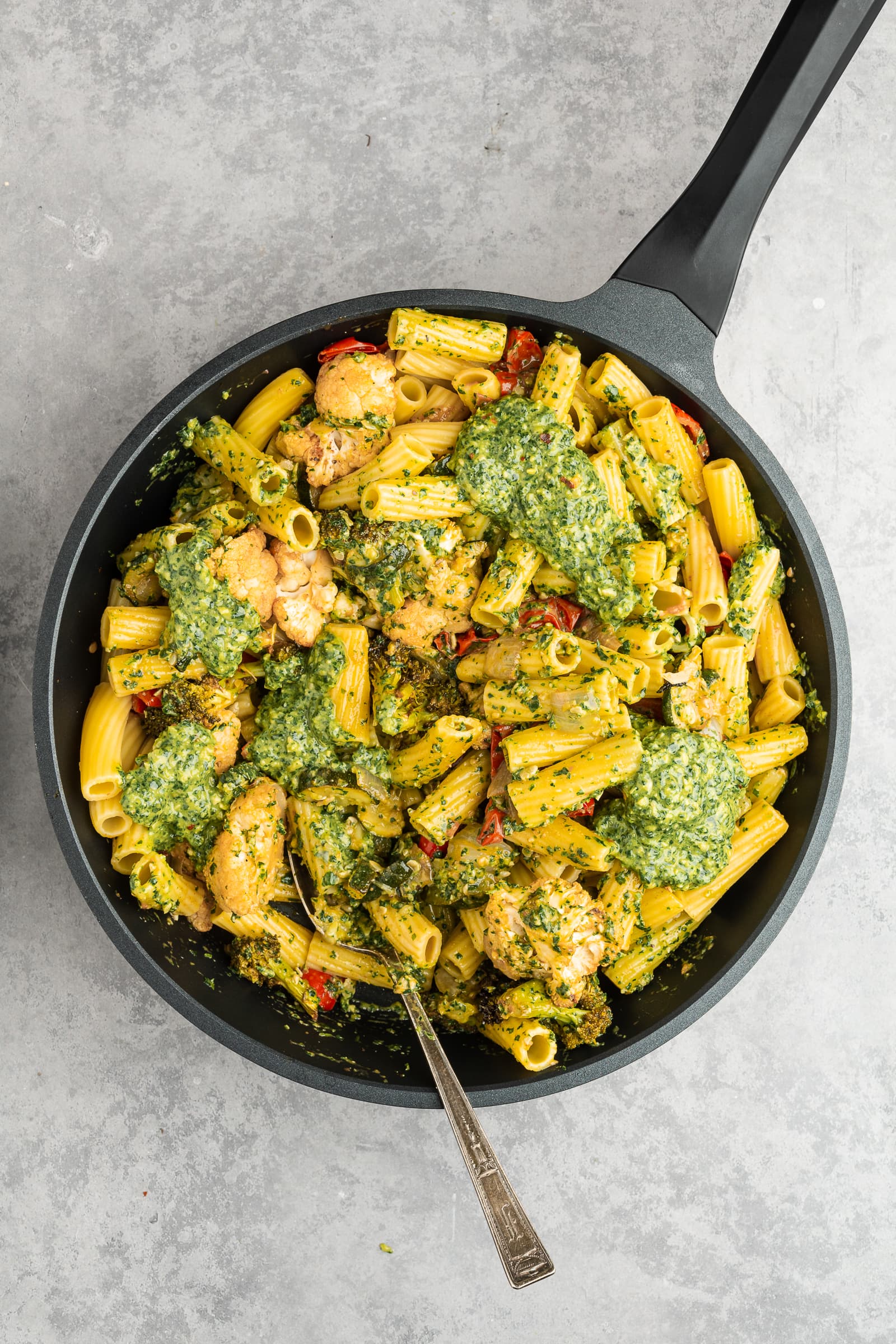 Pesto pasta in a pan.