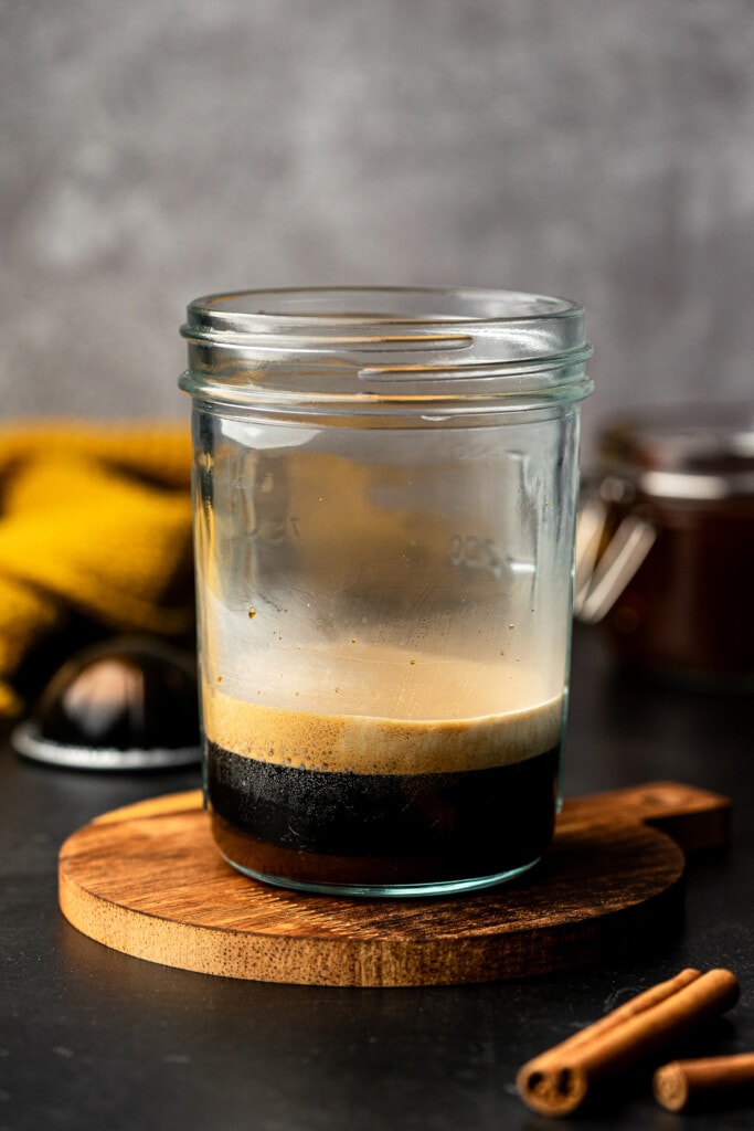 Double espresso shot in a glass jar.
