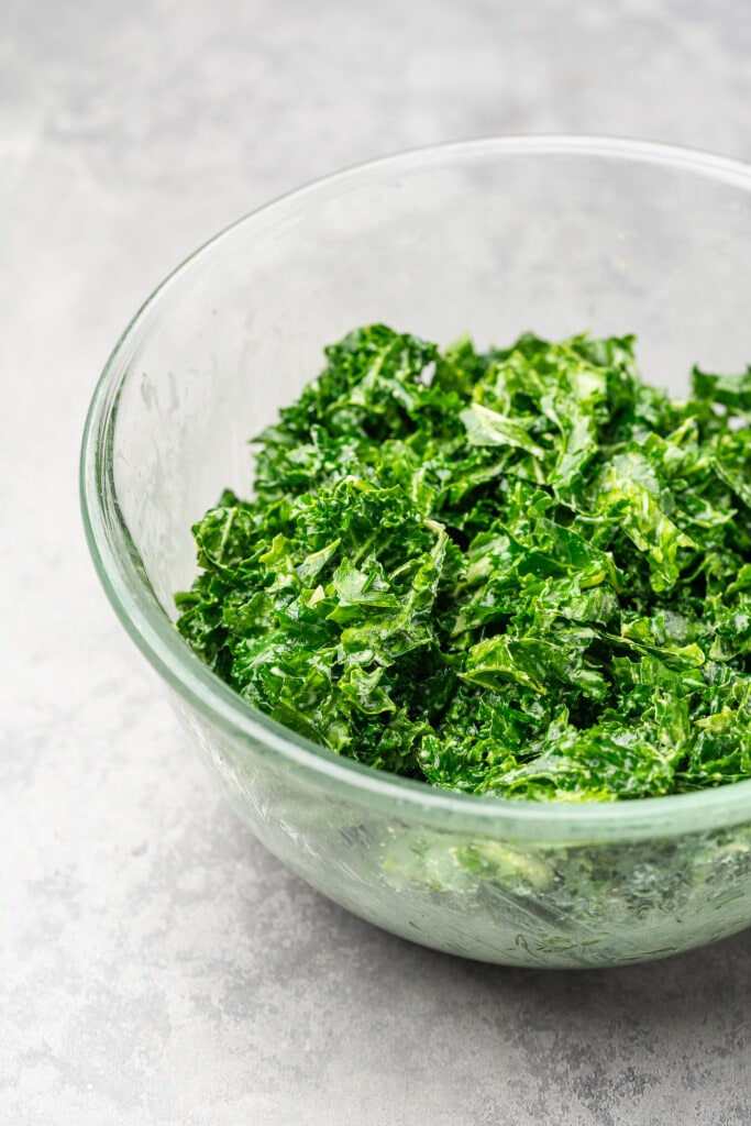 Massaged kale in glass bowl.