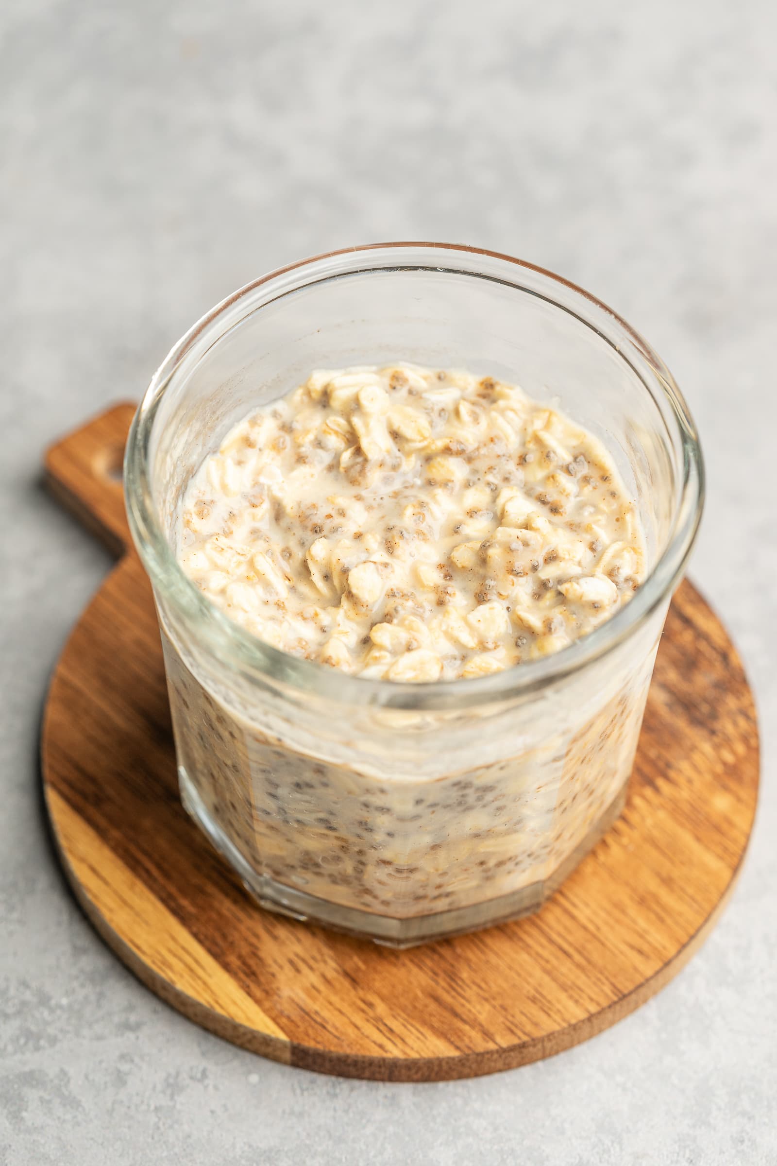 Overnight oats in a glass jar after being refrigerated overnight.