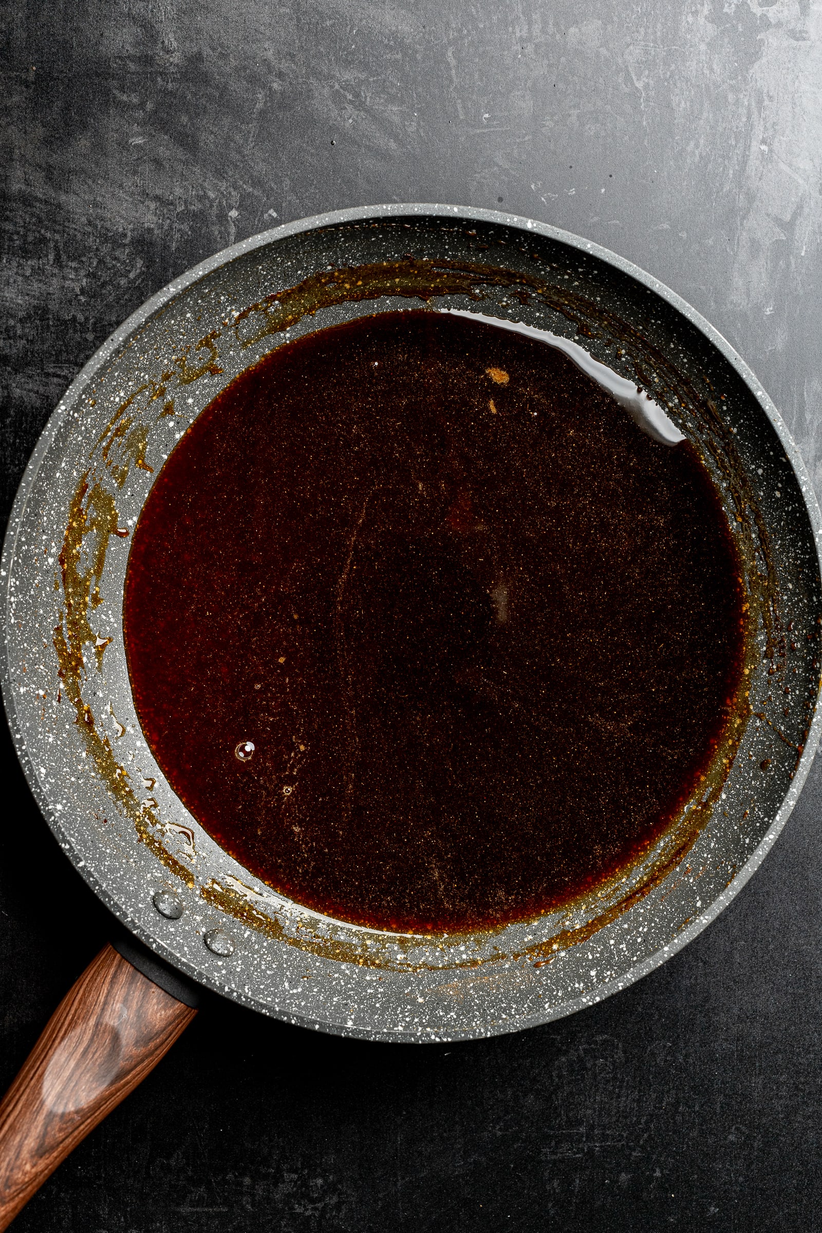 Gingerbread syrup in a pan after being simmered.