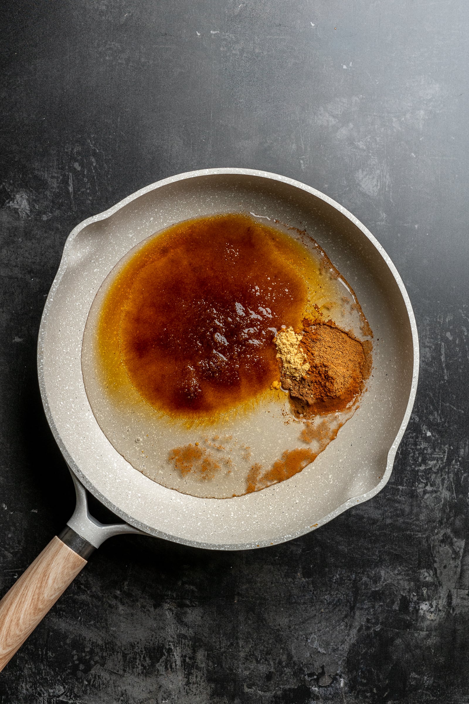 Brown sugar spiced syrup ingredients in a pan.