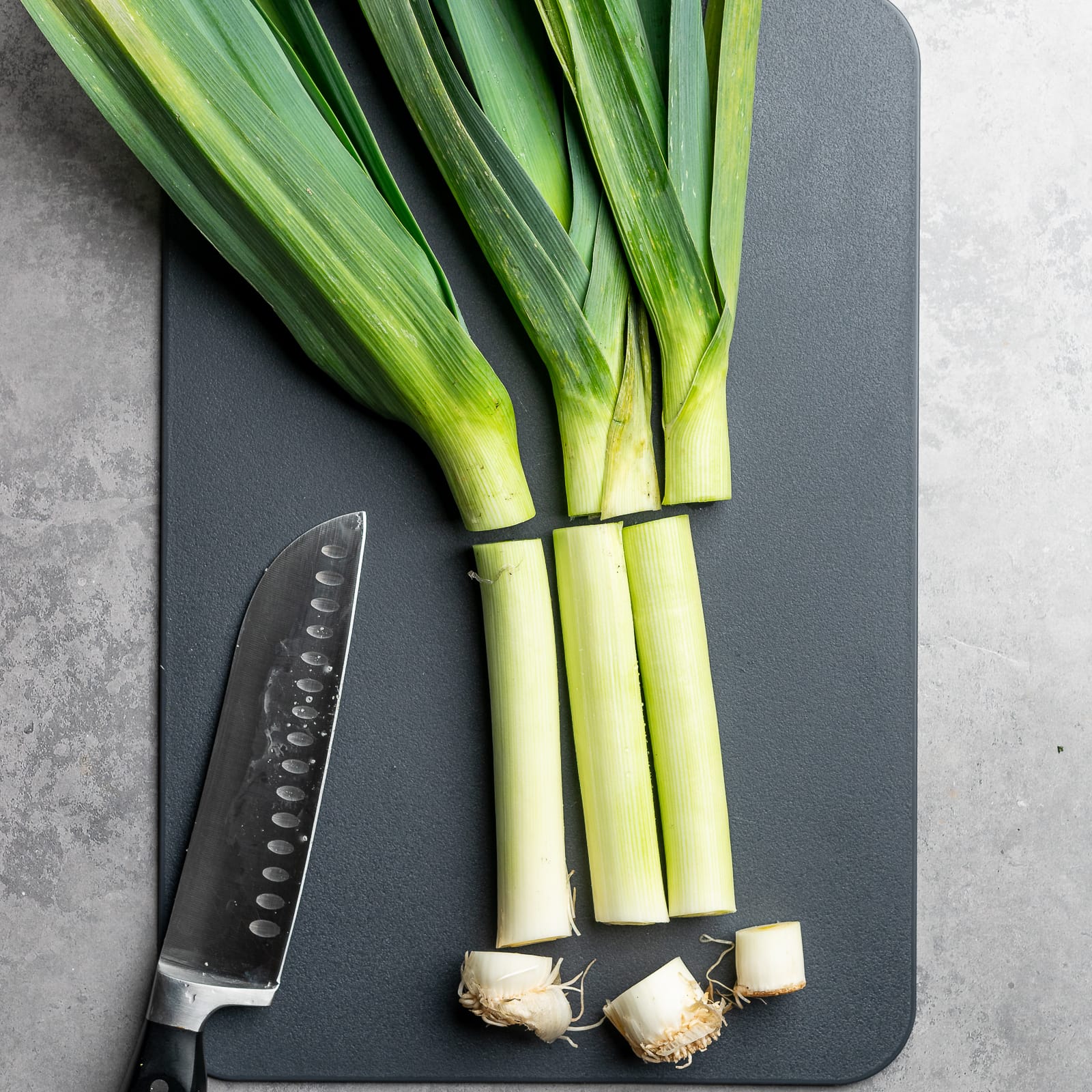 Slice the bottoms off and the tops off the leeks.