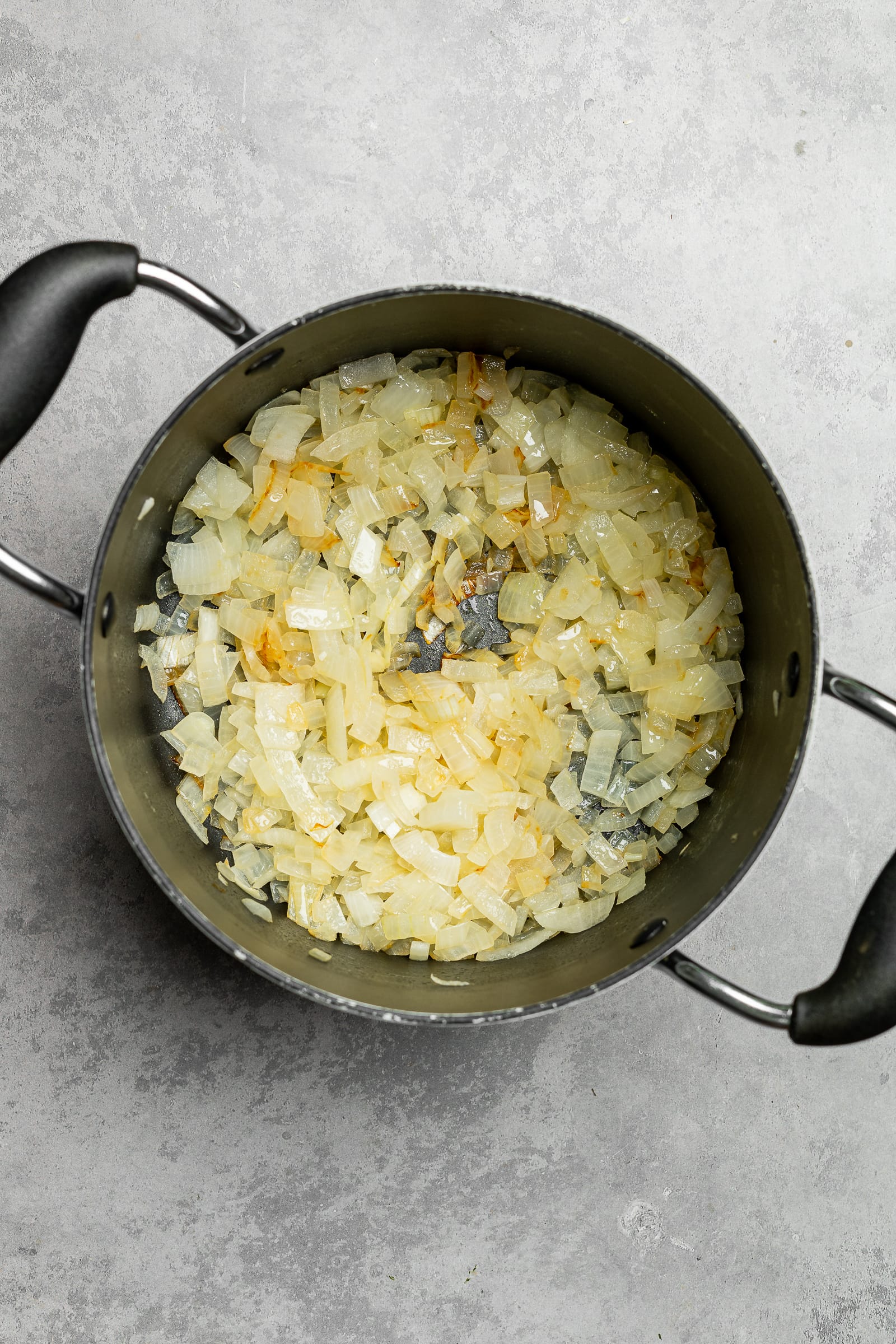 Sautéed onions in a large soup pot.