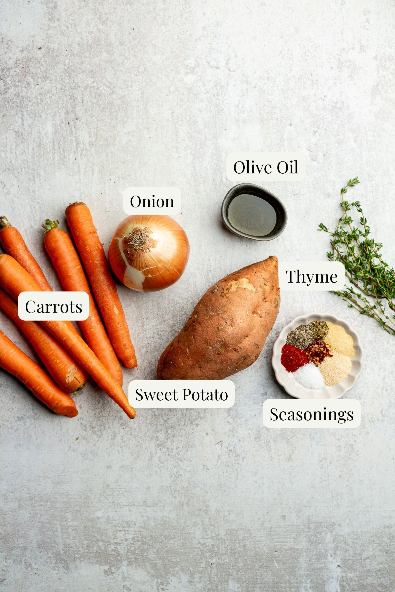 Labeled ingredients for roasted sweet potatoes and carrots.