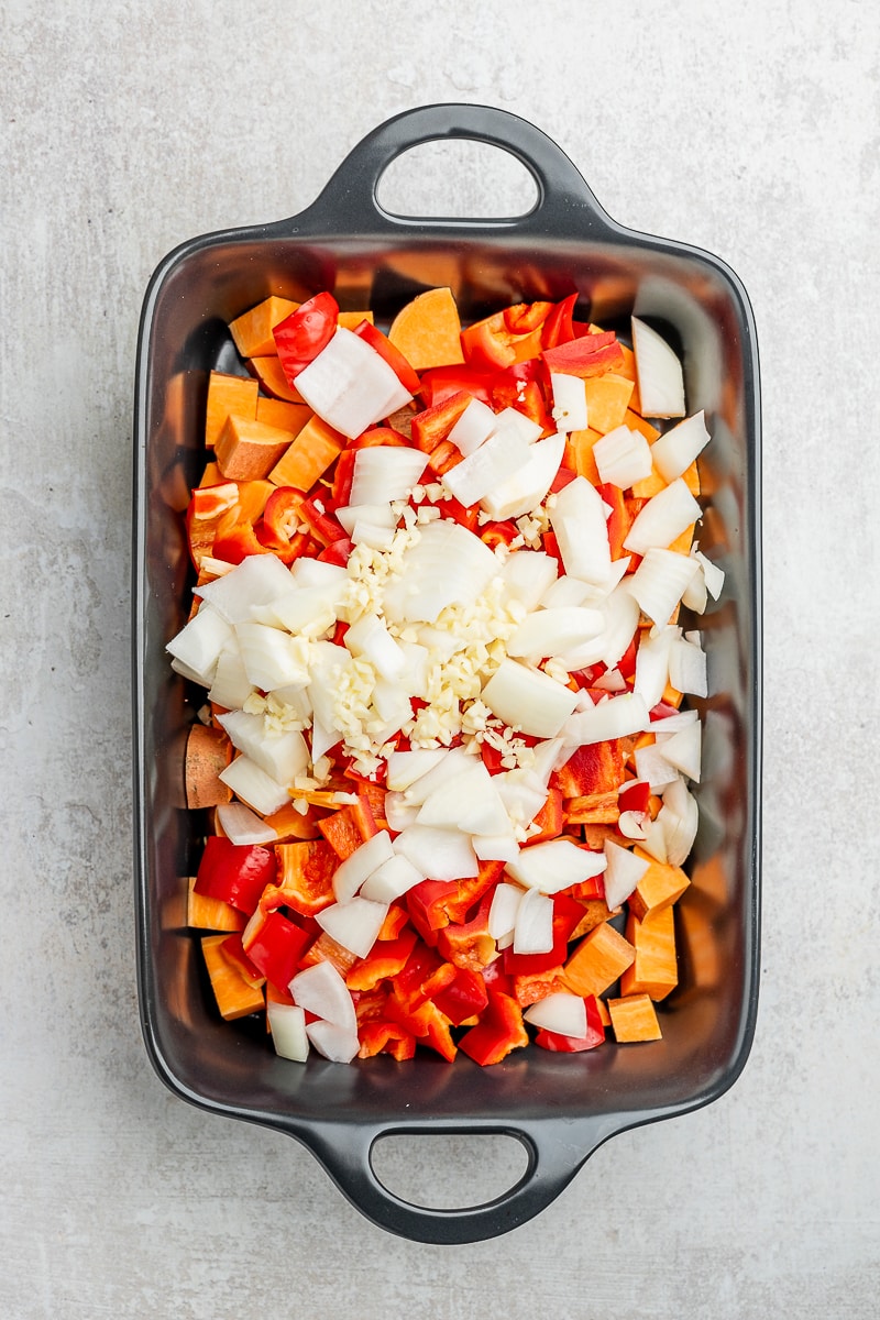 Onion and garlic added to the sweet potato and red peppers.