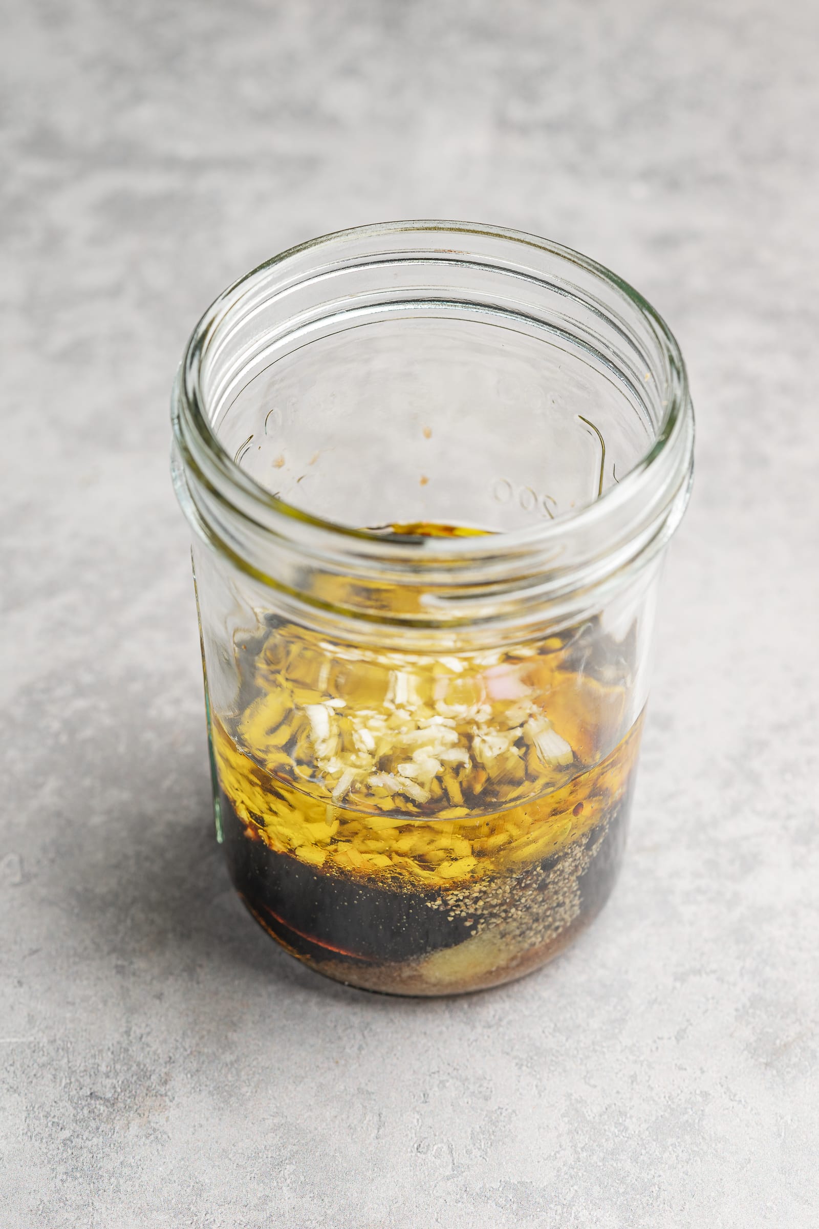 Maple balsamic dressing ingredients in a jar.