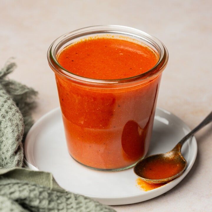 Buffalo sauce in a glass jar container.