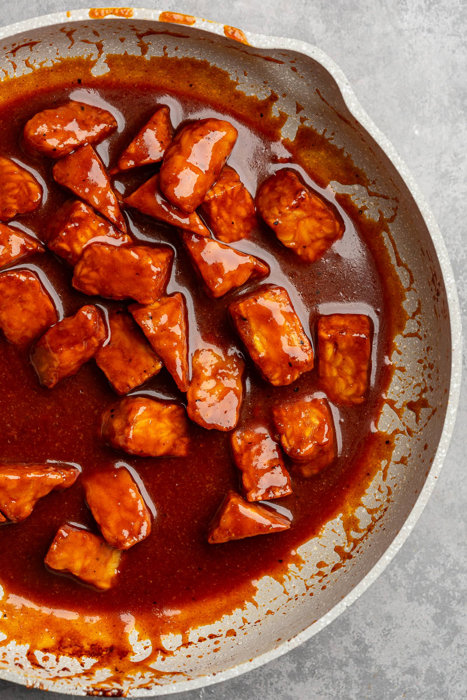 Tempeh simmered in gochujang sauce until coated and thickened.