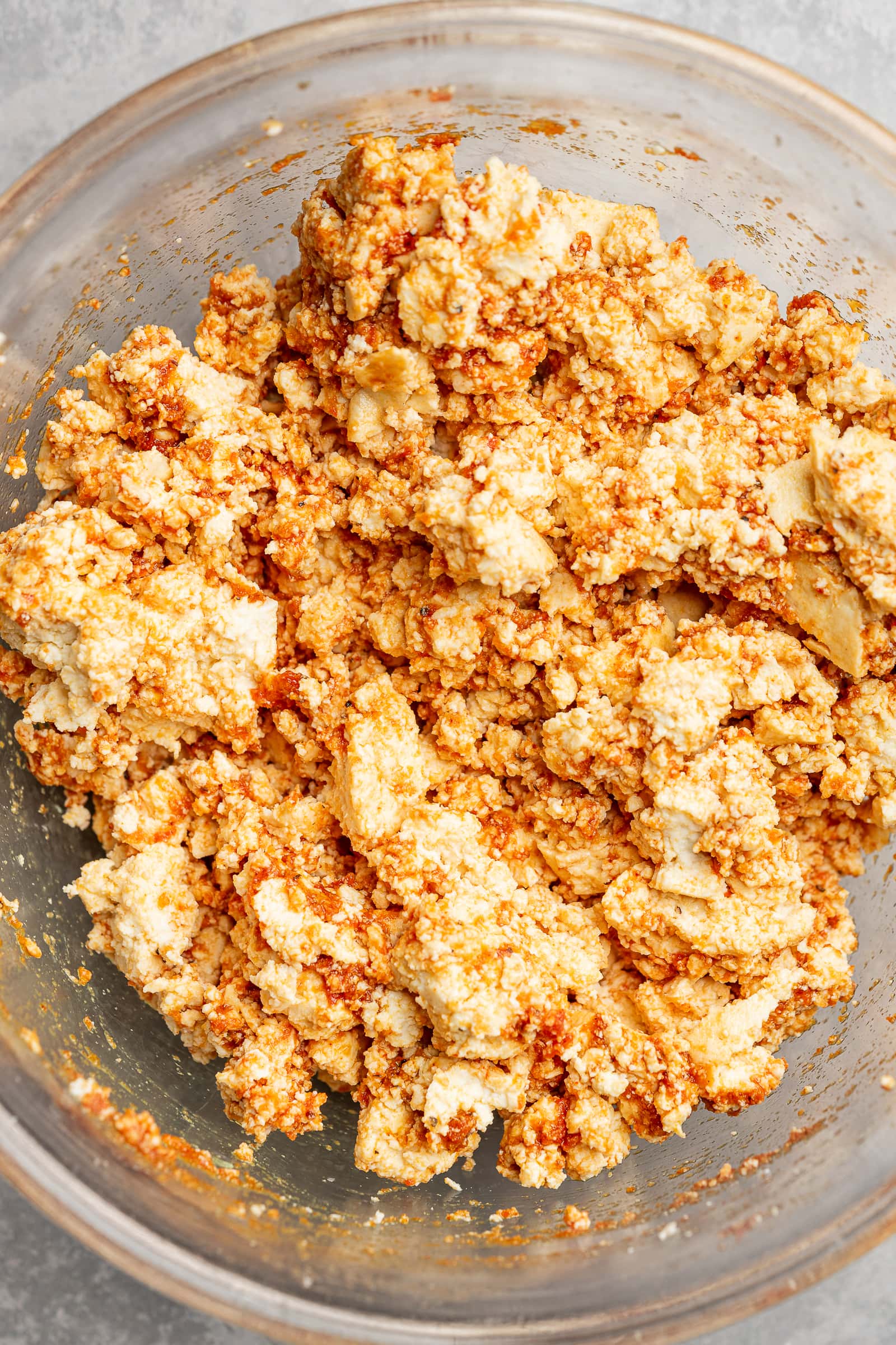 Crumbled tofu tossed into a tomato paste seasoning mixture.