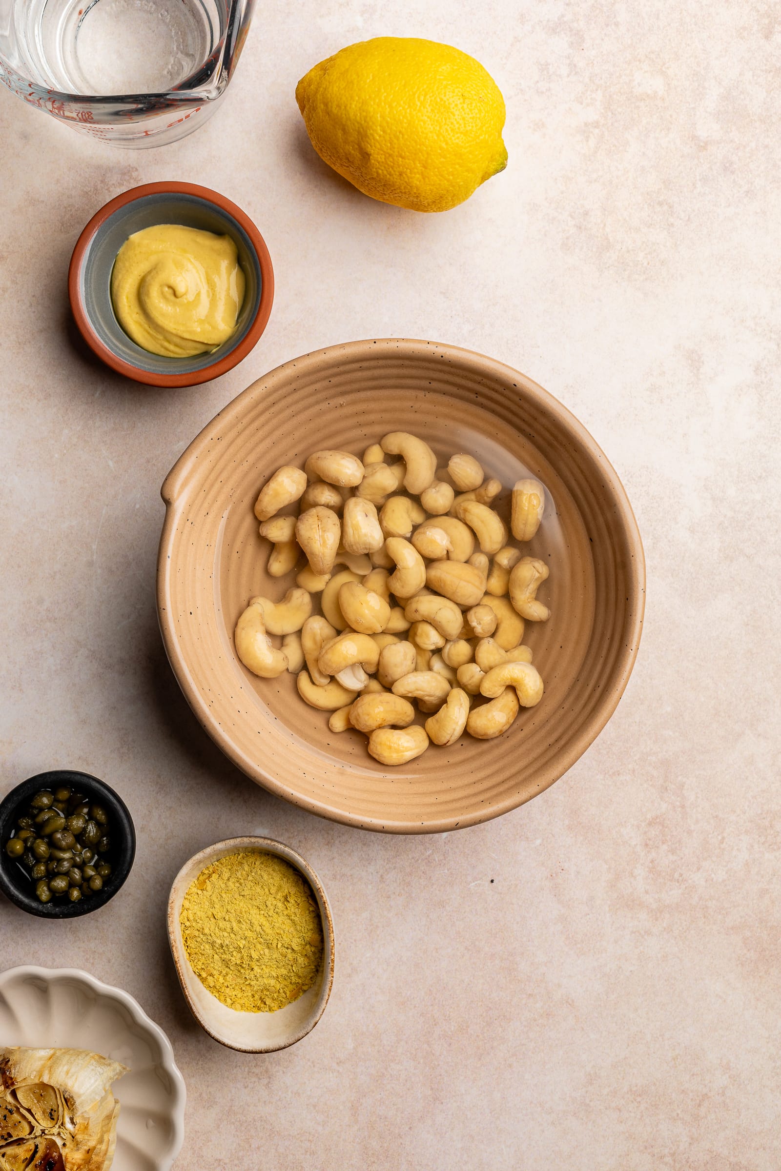 Cashews in a bowl of hot water, soaking.