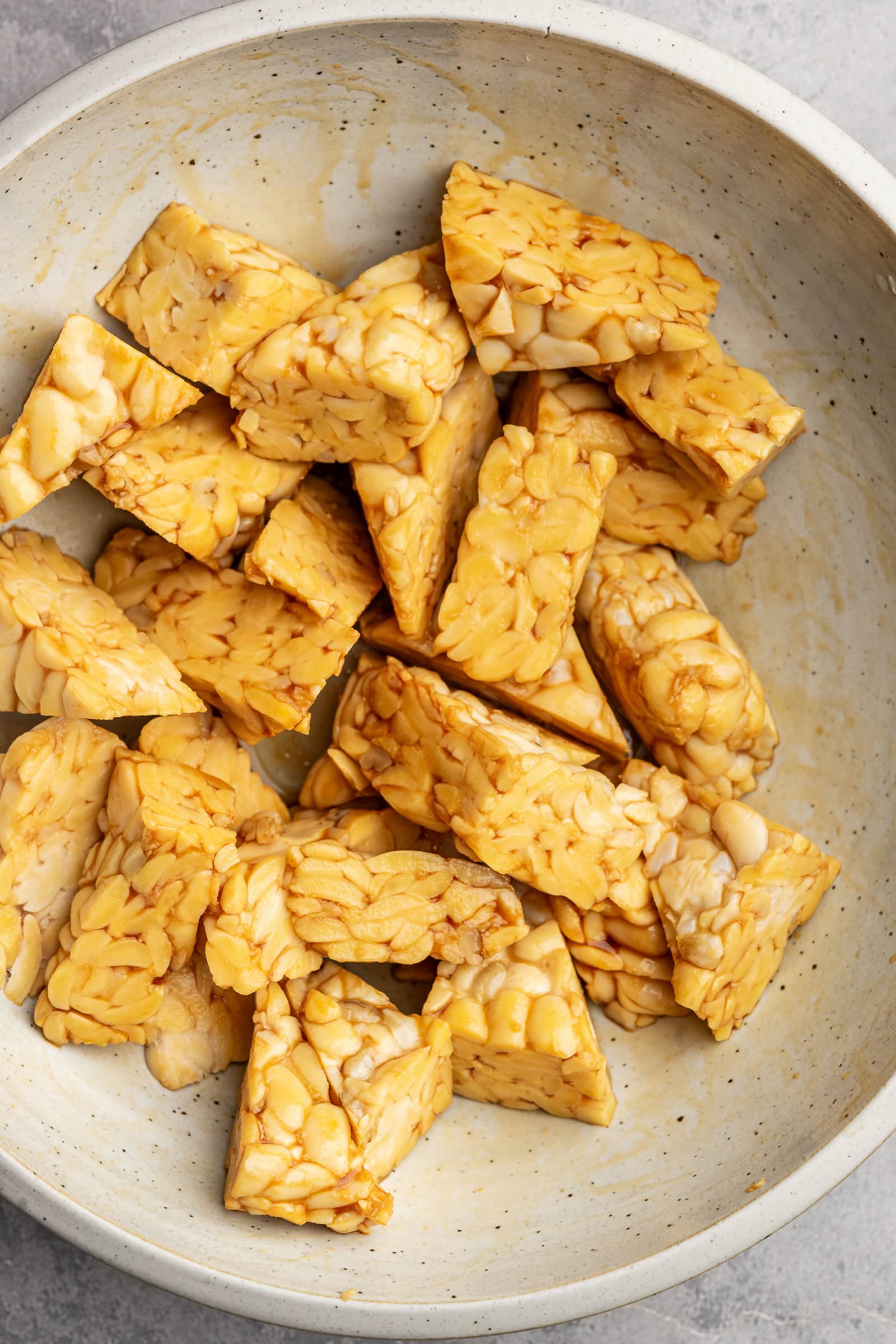 Tempeh cut into triangles and tossed in soy sauce.