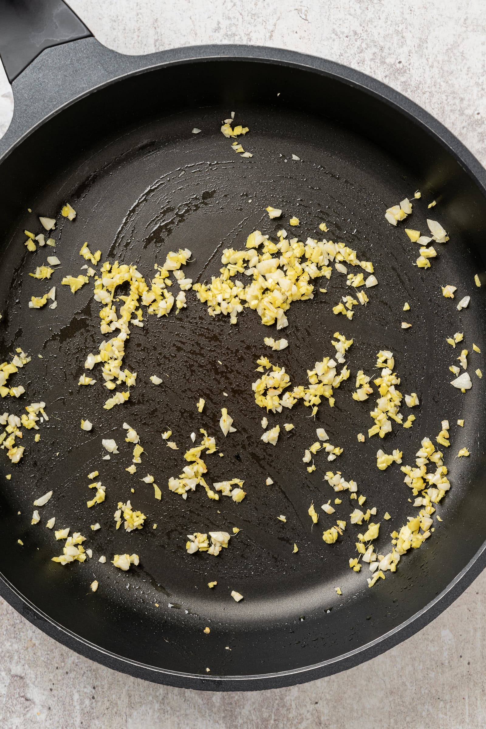 Ginger and garlic in a frying pan.