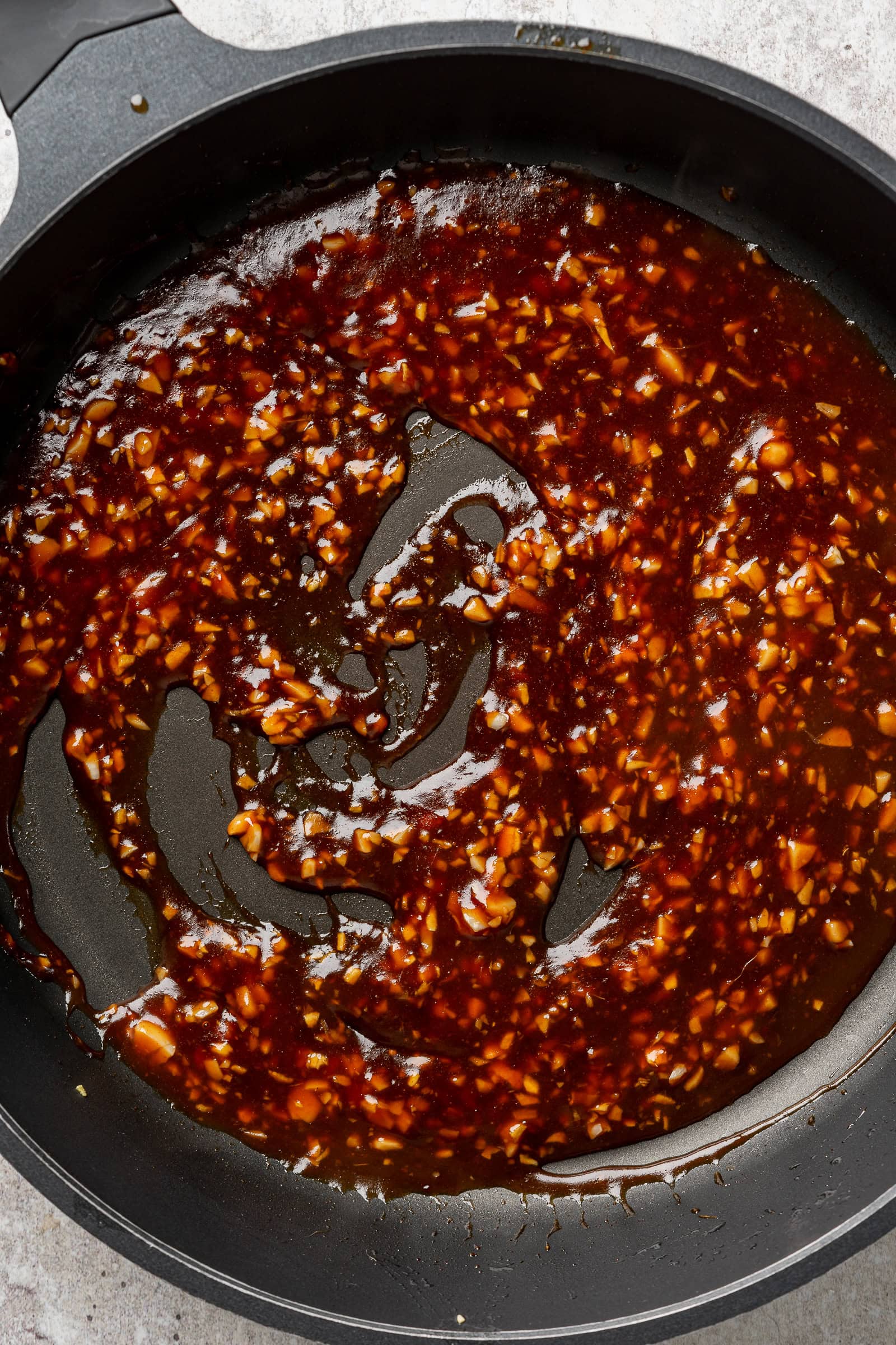 Sticky garlic sauce in pan.