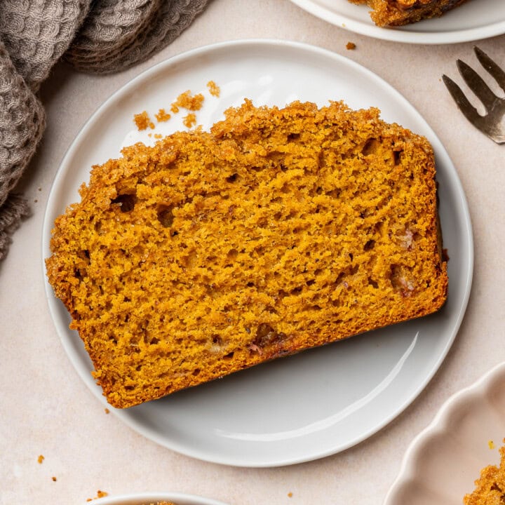 Slice of pumpkin banana bread on a serving plate.