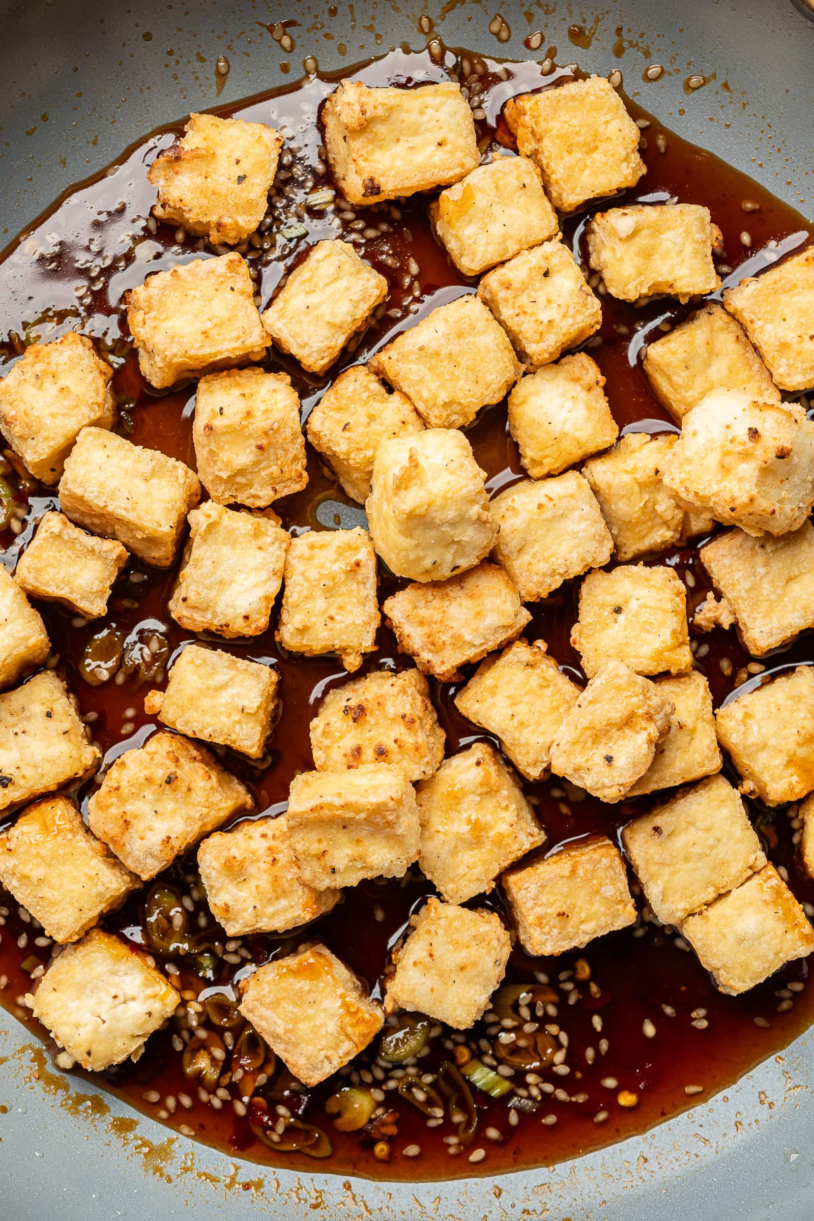 Crispy tofu tossed into sauce.