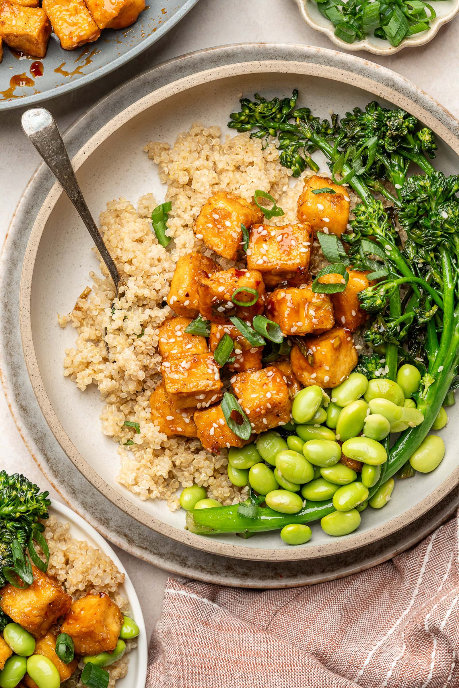 Sweet chili tofu served over quinoa, broccolini, and edamame.